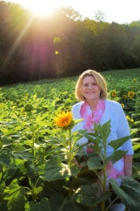 woman in sunflower field