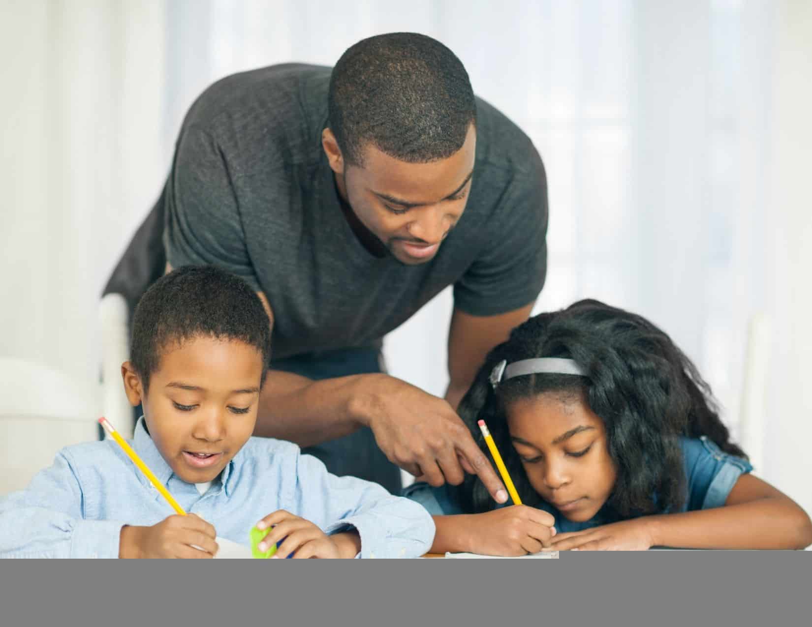 dad helping children with school